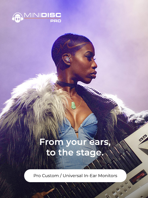 Photo of stage performer Tracyan Martinwearing custom in ear monitors, with overlayed link to Shop Pro Custom In-Ear Monitors.