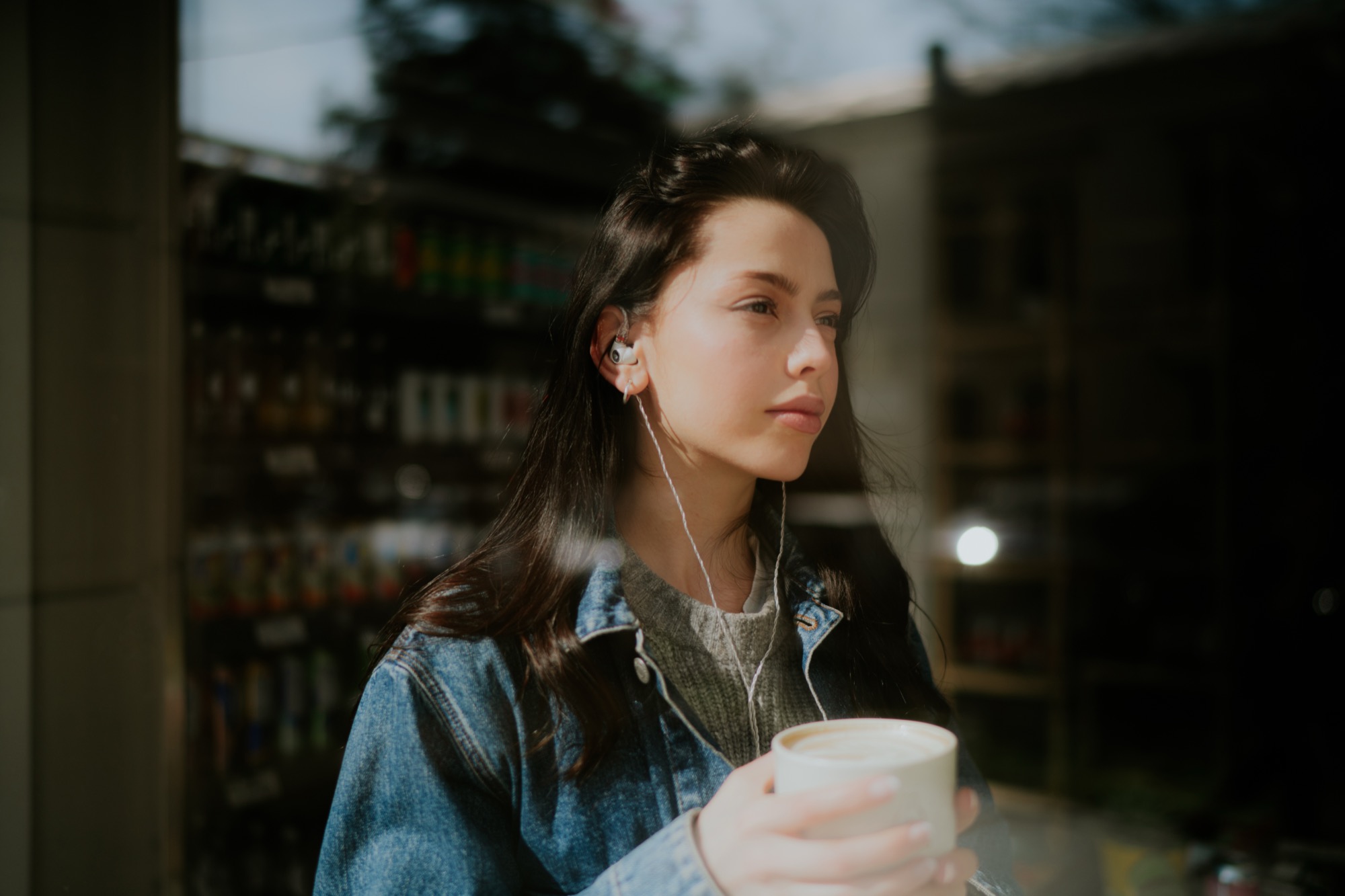 Photo of woman wearing Meze Audio ALBA earphones